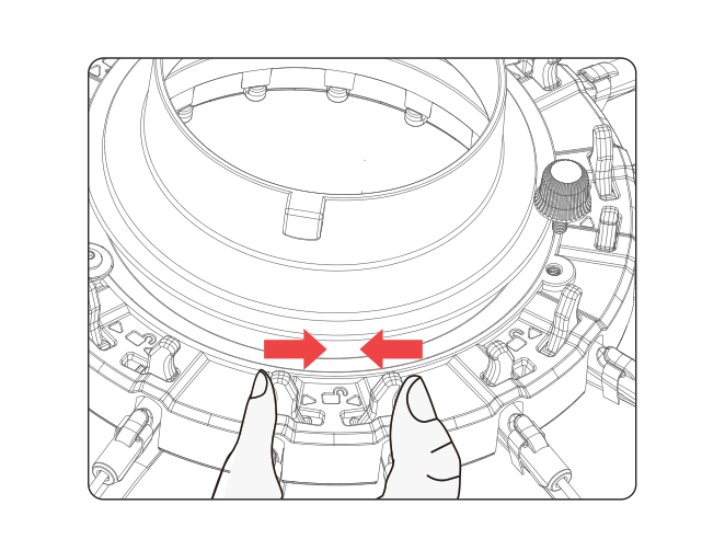 Pressing the two base latches inward to release and collapse the amaran Light Dome