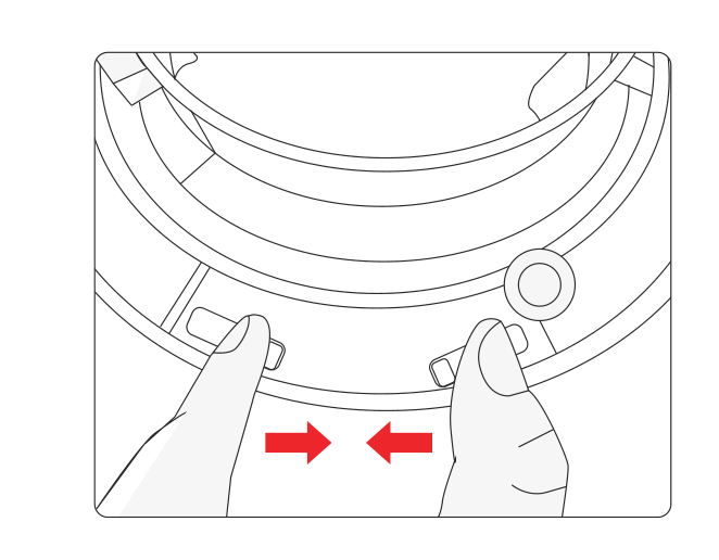 Pressing the two base latches toward the center to release and collapse the softbox